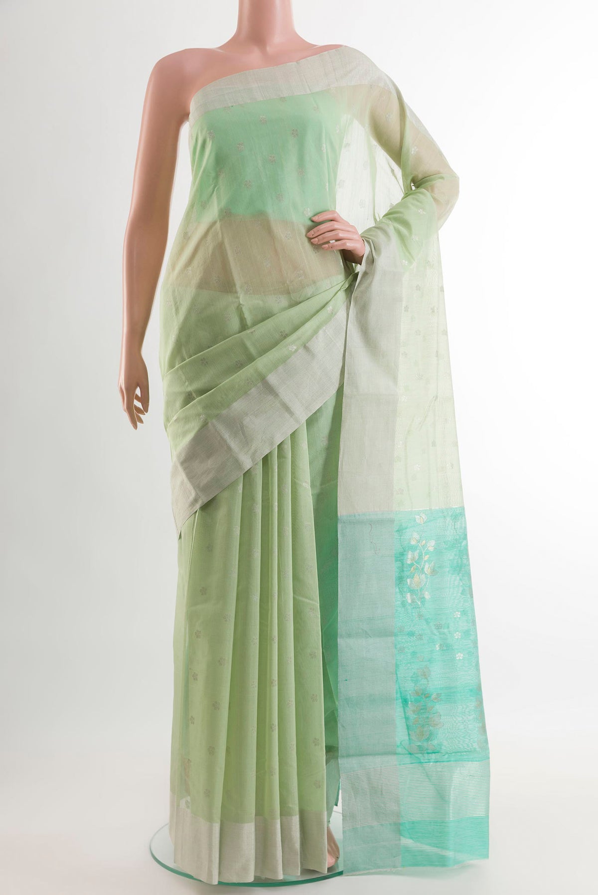 Mint Green Blended Chanderi Silk Cotton Saree with Zari Butta on the body and Zari Border.  displayed on a mannequin