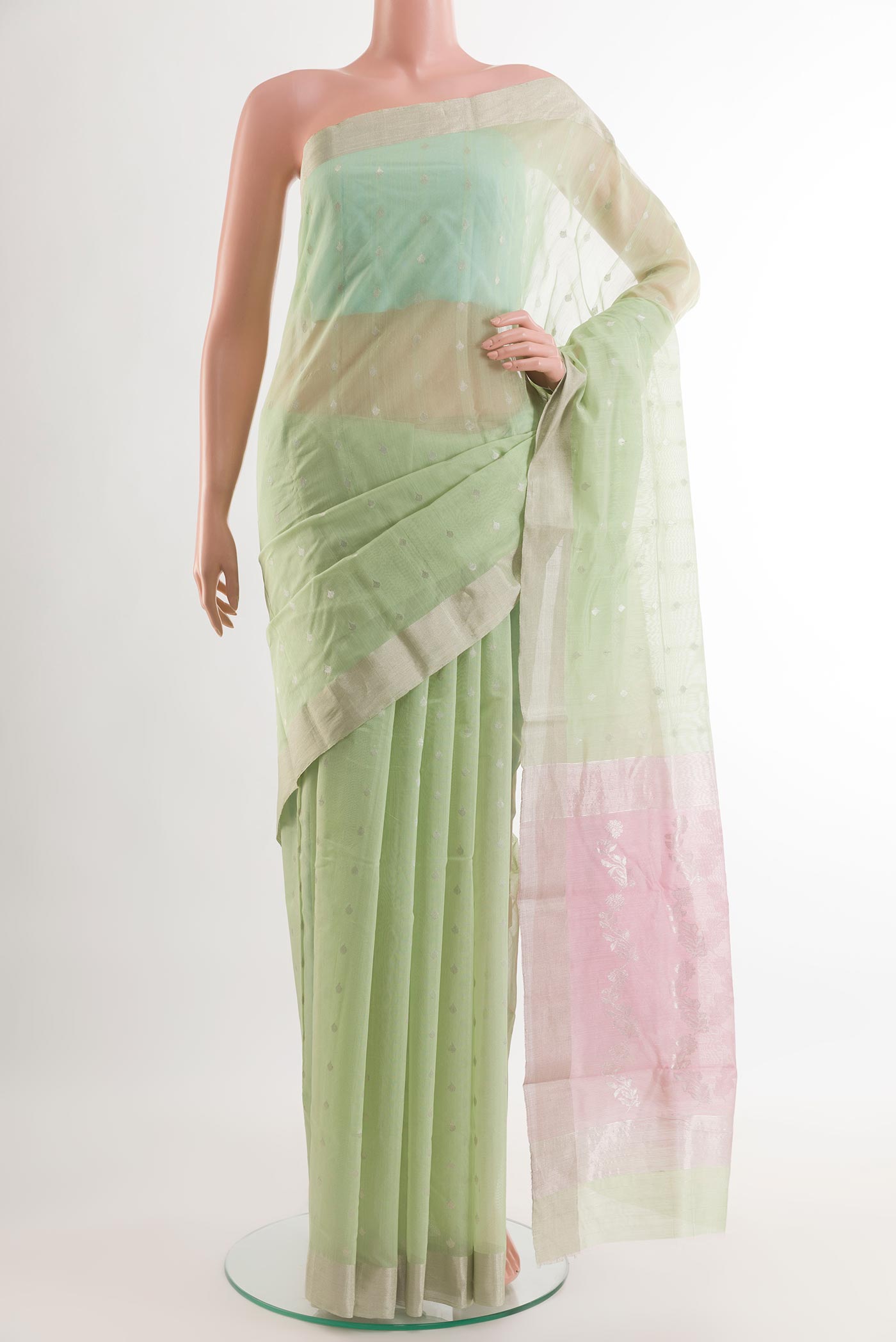 Mint Green Chanderi Silk Saree with Zari Butta on the body and Zari Border.  displayed on a mannequin