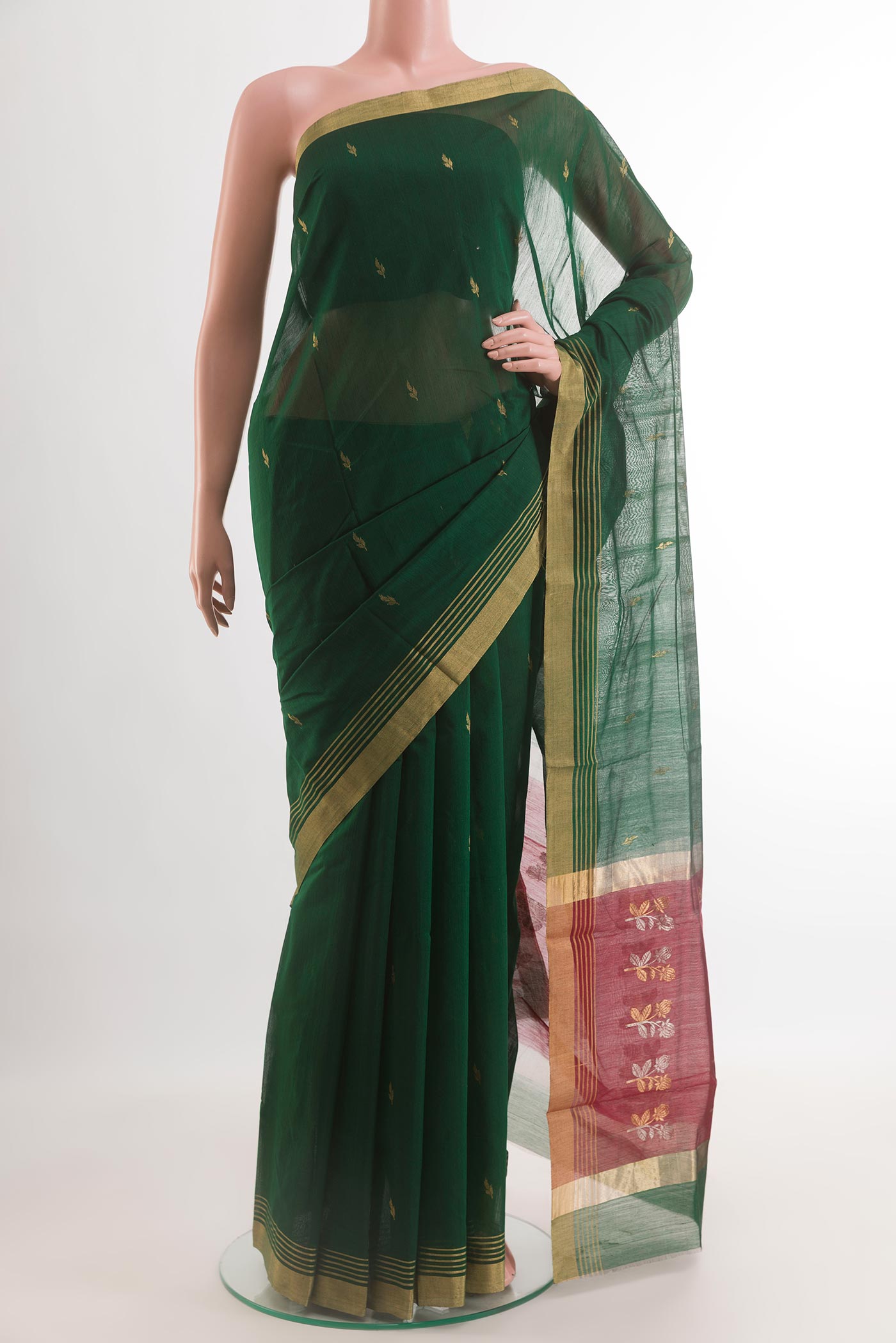 Bottle Green Blended Chanderi Silk Cotton Saree with Zari Butta on the body and Zari Border.  displayed on a mannequin