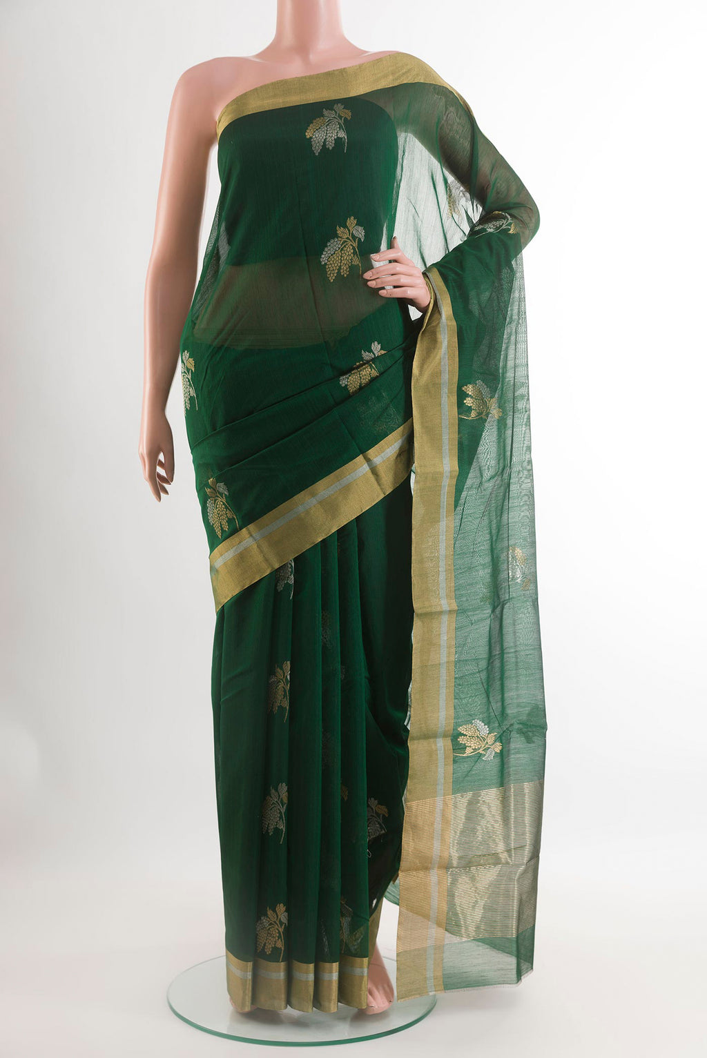 Bottle Green Blended Chanderi Silk Cotton Saree with Zari Butta on the body and Zari Border.  displayed on a mannequin