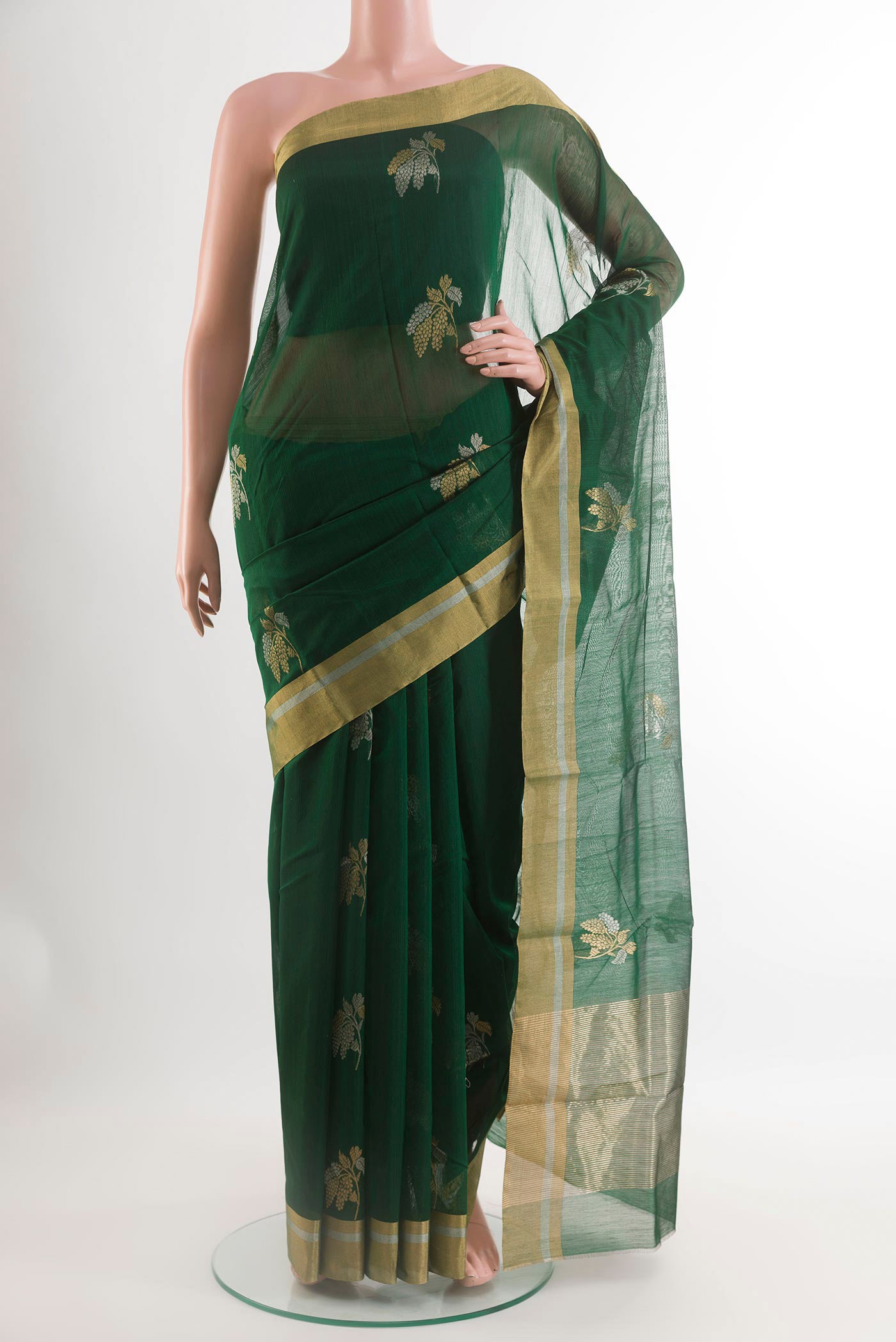 Bottle Green Blended Chanderi Silk Cotton Saree with Zari Butta on the body and Zari Border.  displayed on a mannequin