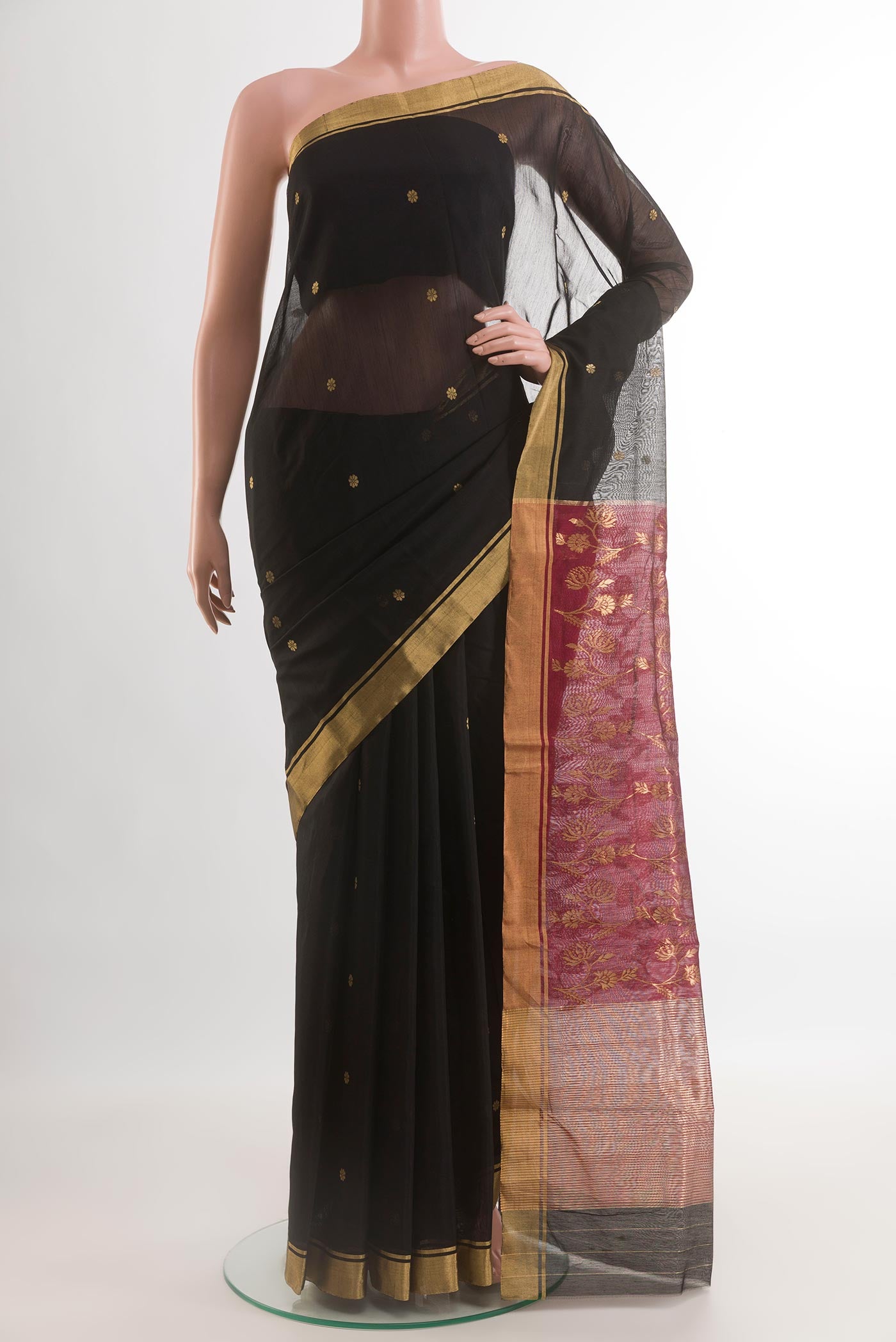Black Chanderi Silk Cotton Saree with Zari Butta on the body and Zari Border.  displayed on a mannequin