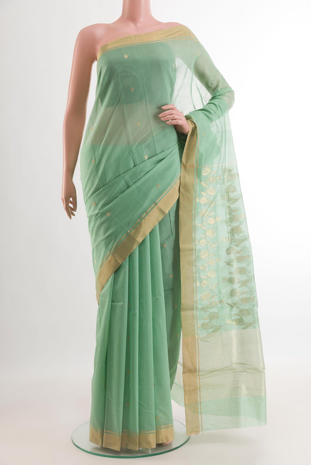 Sea Green Chanderi Silk Cotton Saree with Zari Butta on the body and Zari Border.  displayed on a mannequin