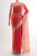 Orange Blended Chanderi Silk Cotton Saree with Zari Butta on the body and Zari Border.  displayed on a mannequin