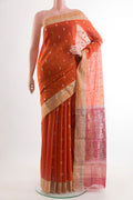 Orange Blended Chanderi Silk Cotton Saree with Zari Butta on the body and Zari Border.  displayed on a mannequin