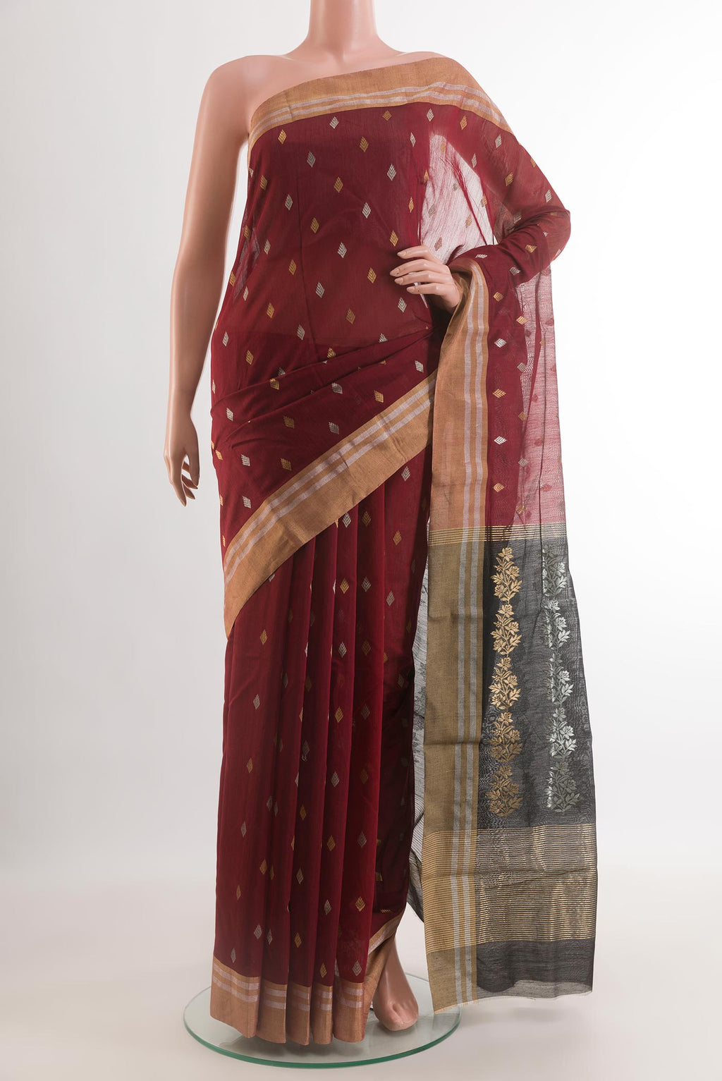 Maroon Chanderi Silk Cotton Saree with Zari Butta on the body and Zari Border.  displayed on a mannequin