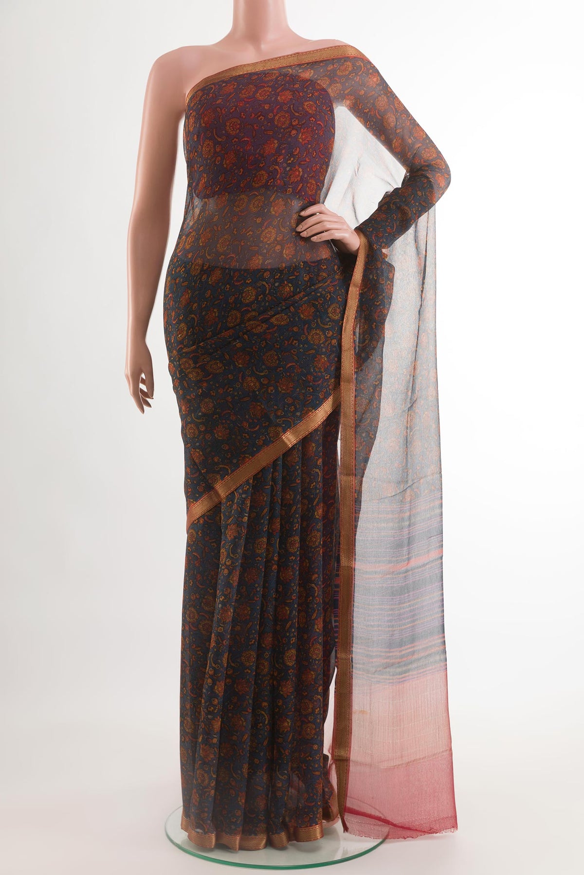 Dark Blue Chiffon Saree with Printed design on the body and Zari Border.  displayed on a mannequin