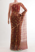 Red Chiffon Saree with Printed design on the body and Zari Border.  displayed on a mannequin