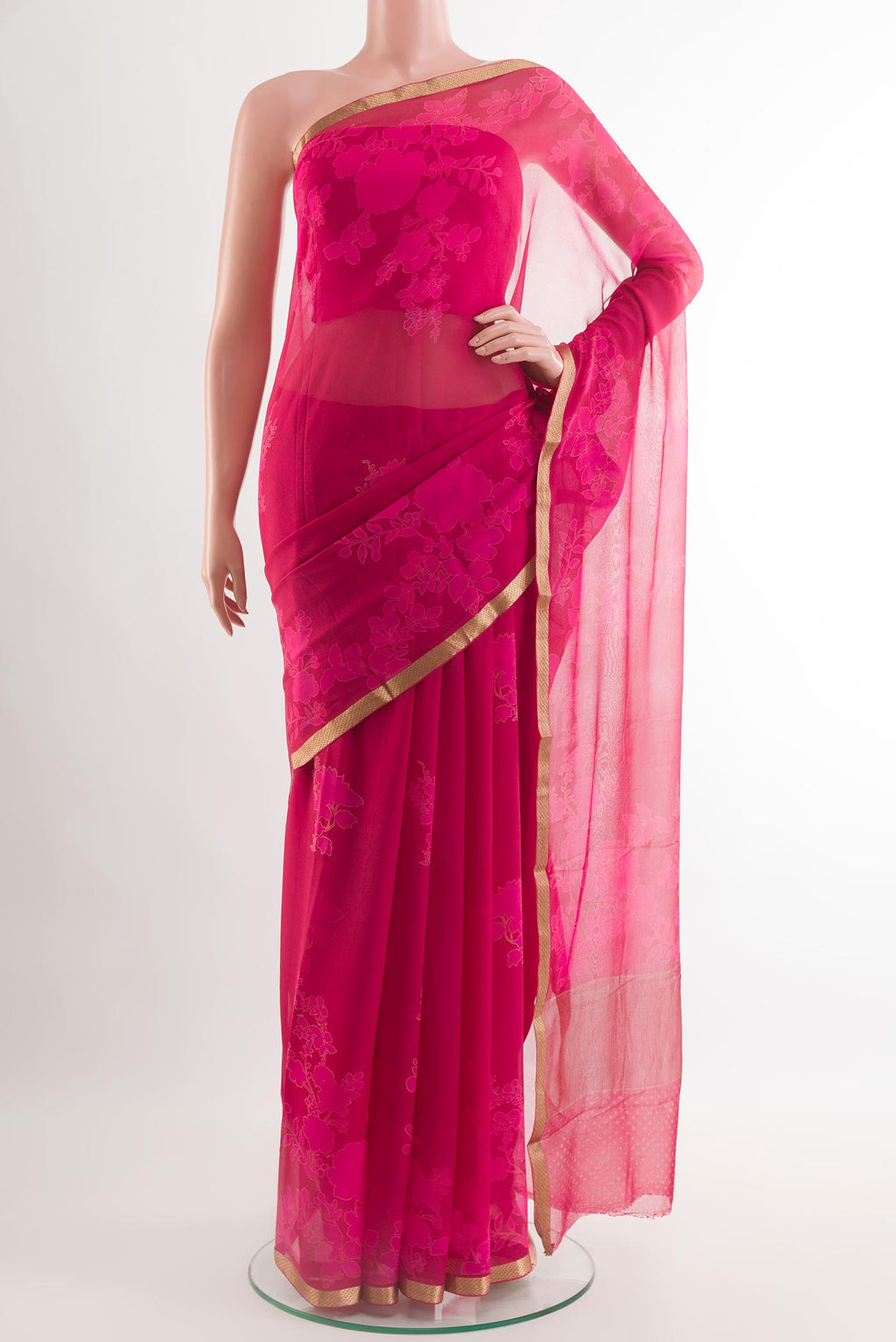 Pink Chiffon Saree with Printed design on the body and Plain Border.  displayed on a mannequin