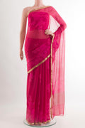 Pink Chiffon Saree with Printed design on the body and Plain Border.  displayed on a mannequin