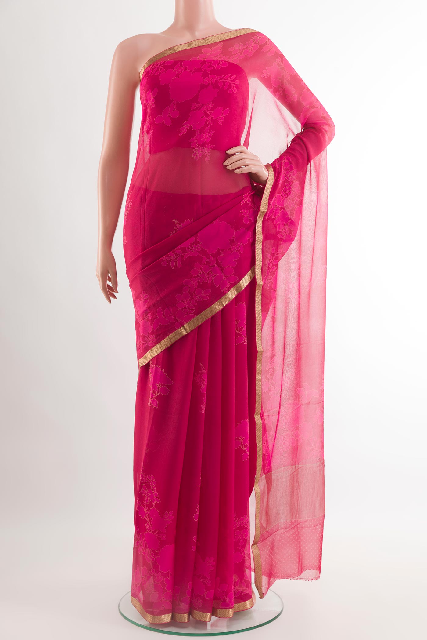 Pink Chiffon Saree with Printed design on the body and Plain Border.  displayed on a mannequin
