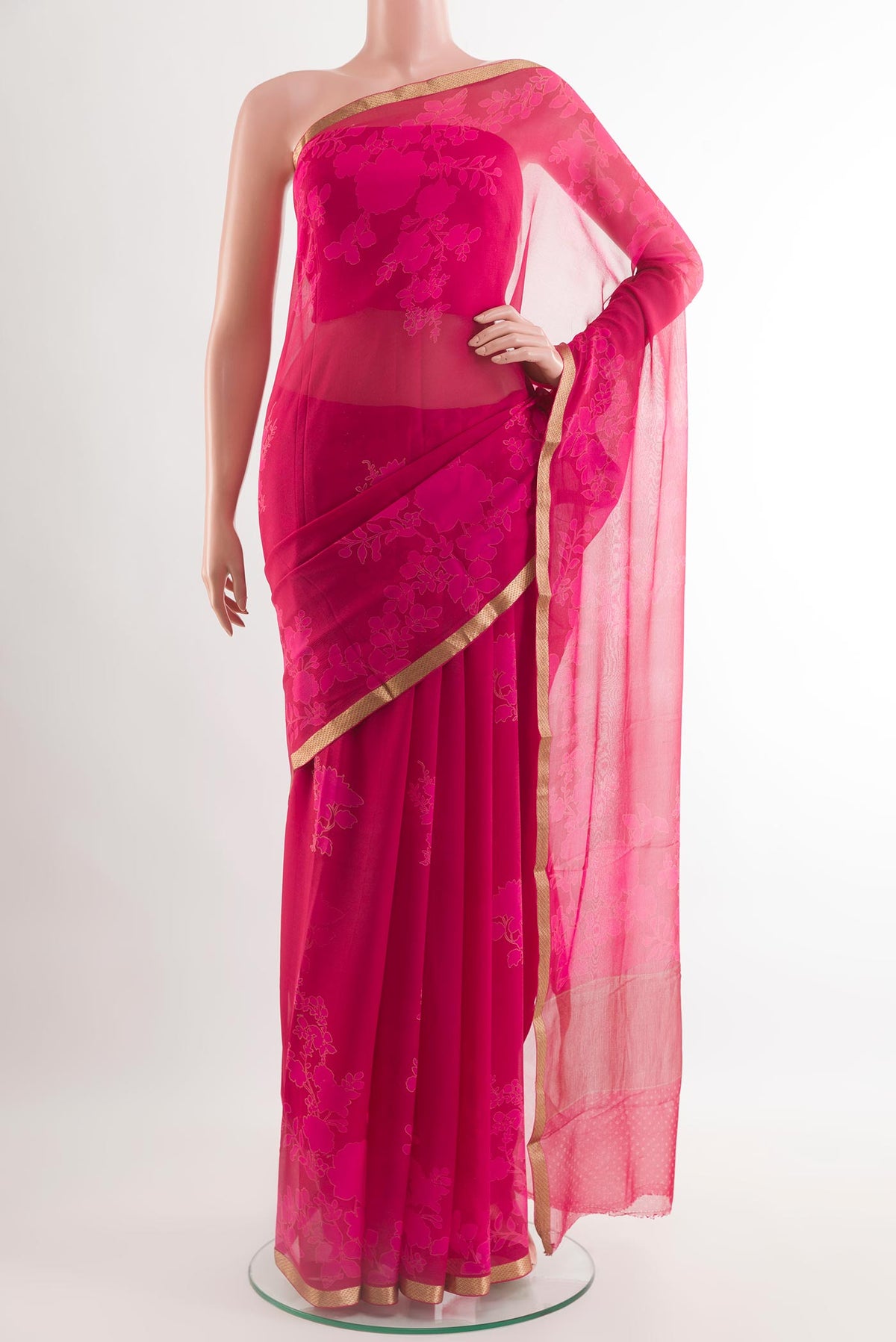 Pink Chiffon Saree with Printed design on the body and Plain Border.  displayed on a mannequin