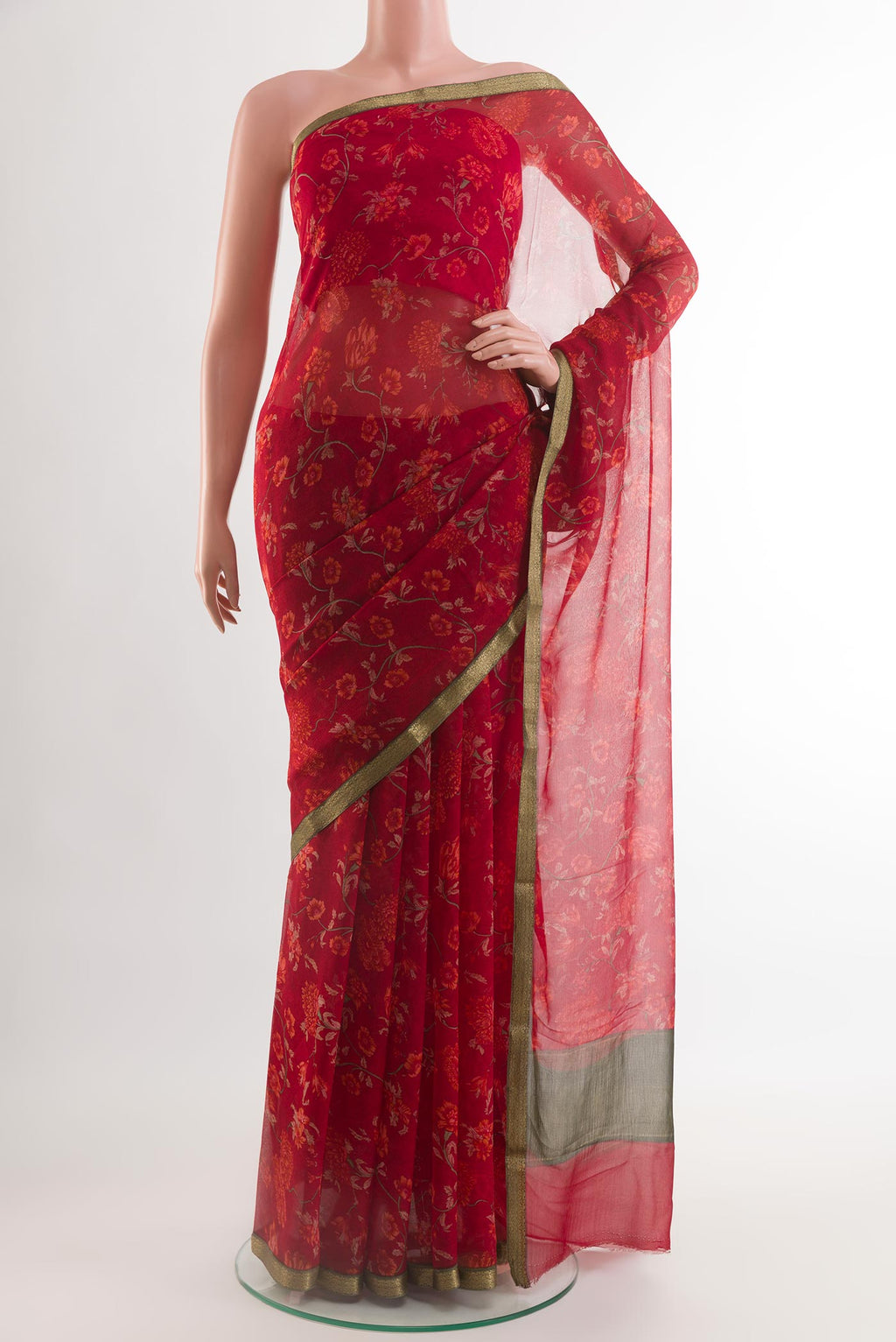 Red Chiffon Saree with Printed design on the body and Plain Border.  displayed on a mannequin