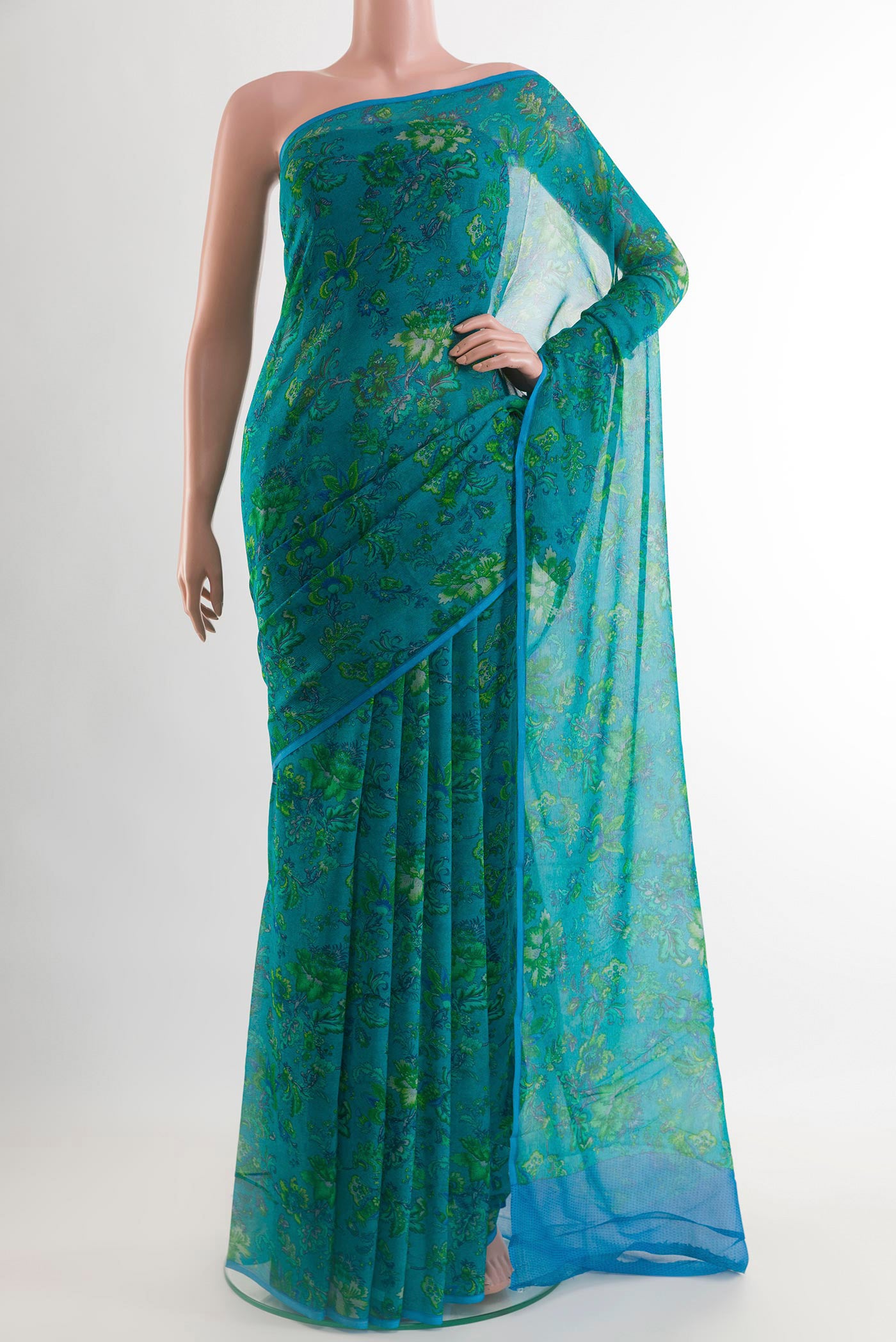 Blue Mysore Chiffon Saree with Printed design on the body and Zari Border.  displayed on a mannequin