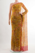 Yellow Chiffon Saree with Printed design on the body and Plain Border.  displayed on a mannequin