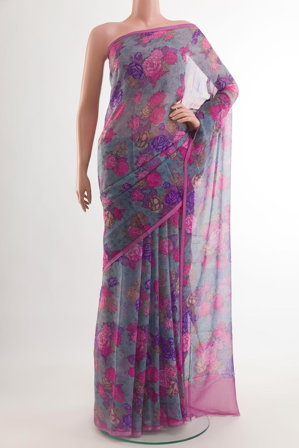 Blue Chiffon Saree with Printed design on the body and Plain Border.  displayed on a mannequin