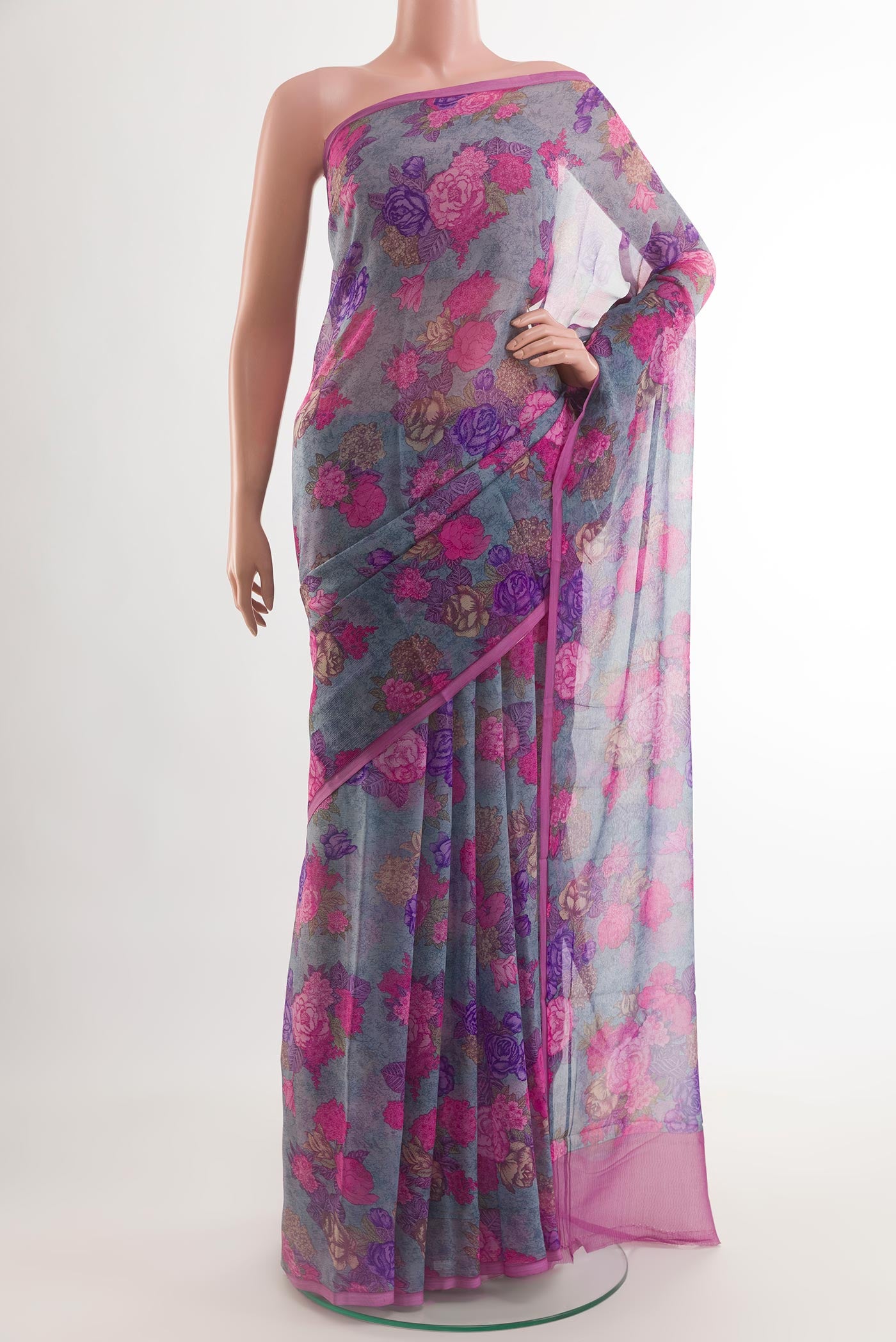 Blue Chiffon Saree with Printed design on the body and Plain Border.  displayed on a mannequin