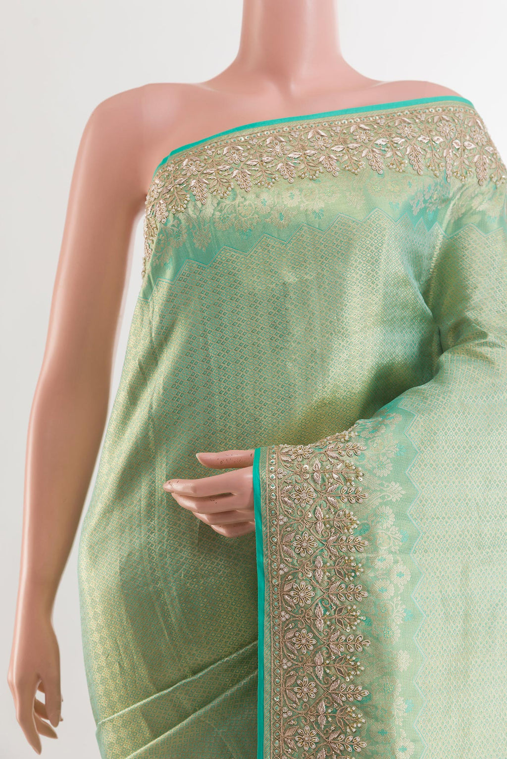 Border image of Sea Green Kanjivaram Tissue Silk Saree with Zari Butta on the body and Embroidery Border. 