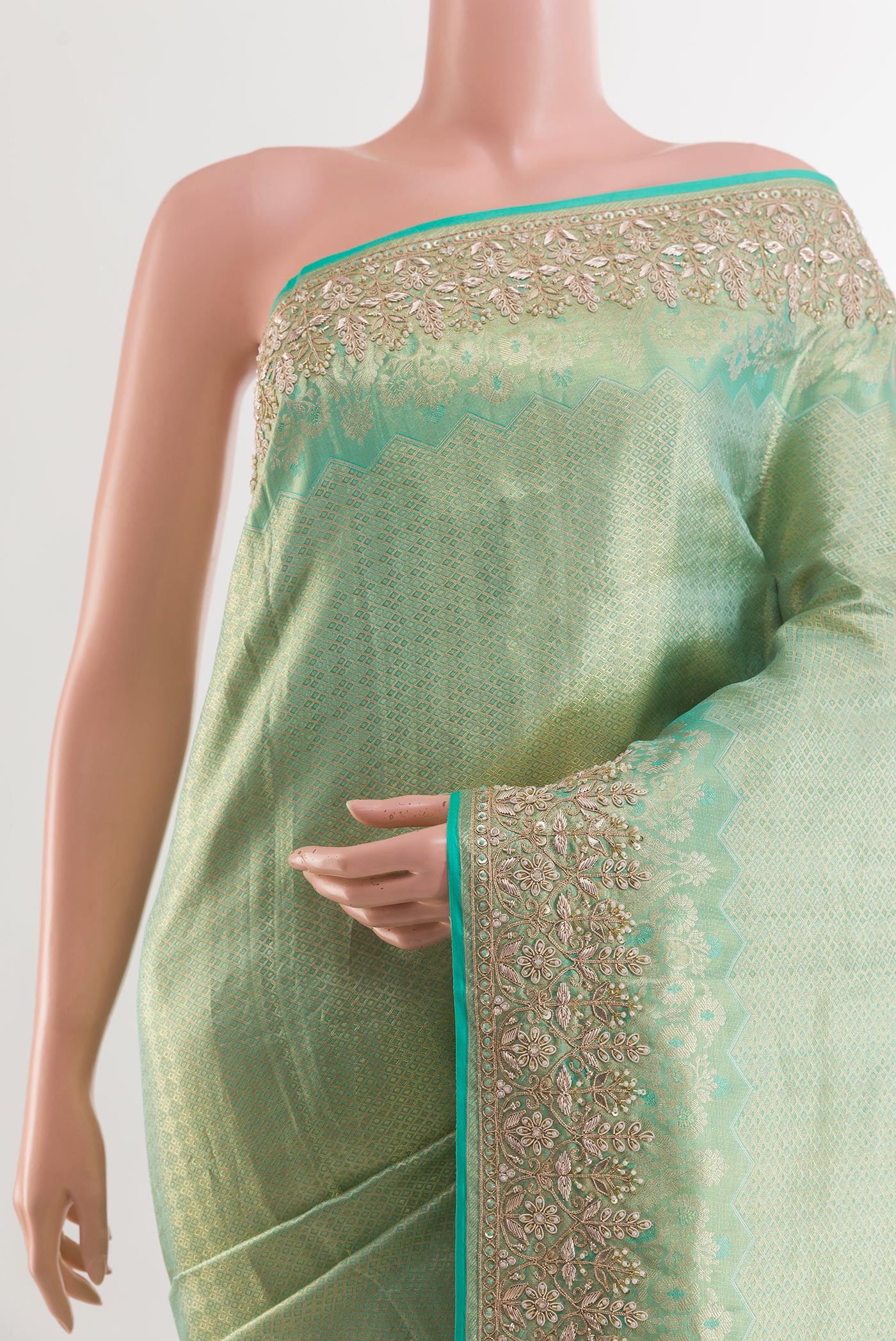 Border image of Sea Green Kanjivaram Tissue Silk Saree with Zari Butta on the body and Embroidery Border. 