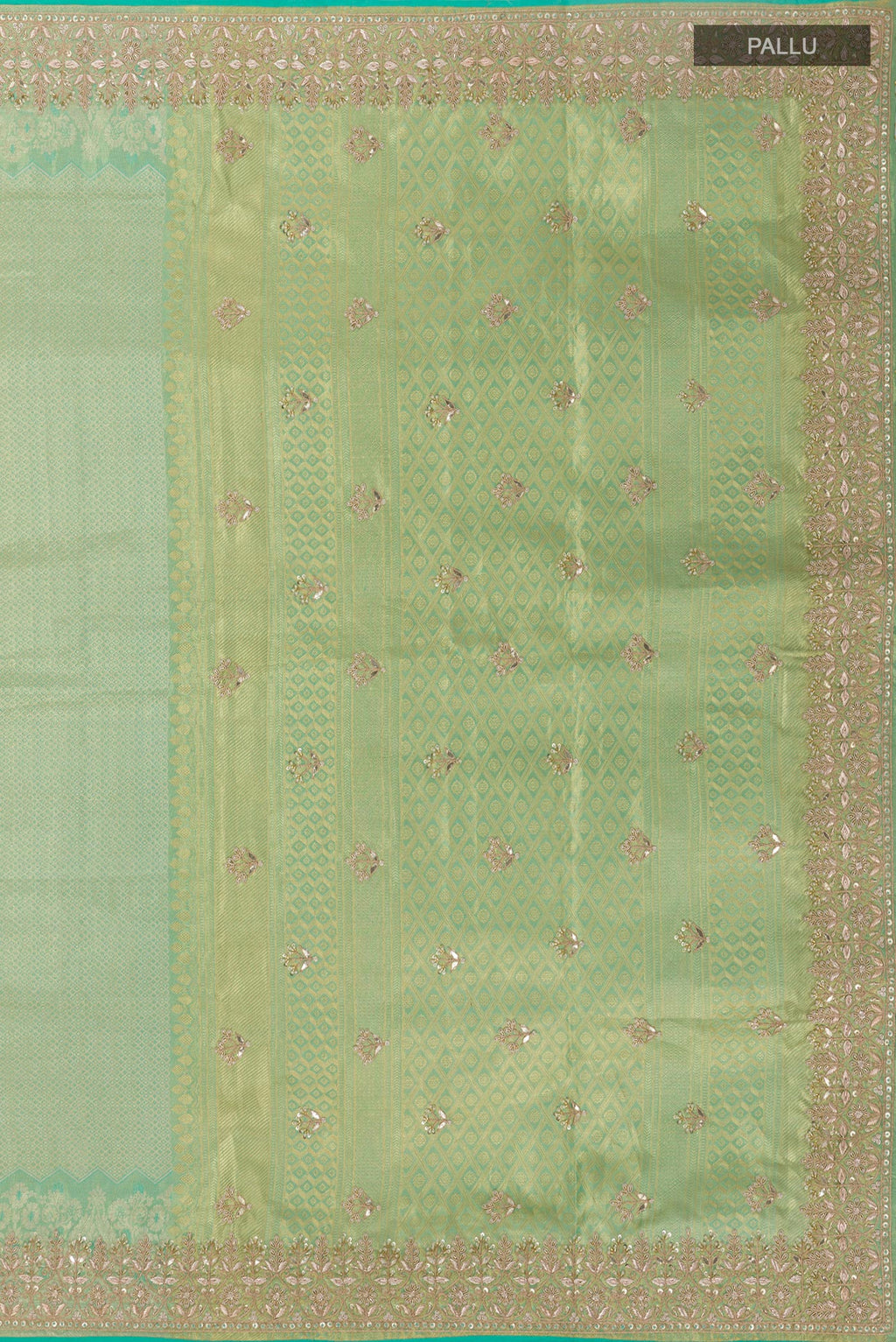 Close up image of the pallu of Sea Green Kanjivaram Tissue Silk Saree with Zari Butta on the body and Embroidery Border. 