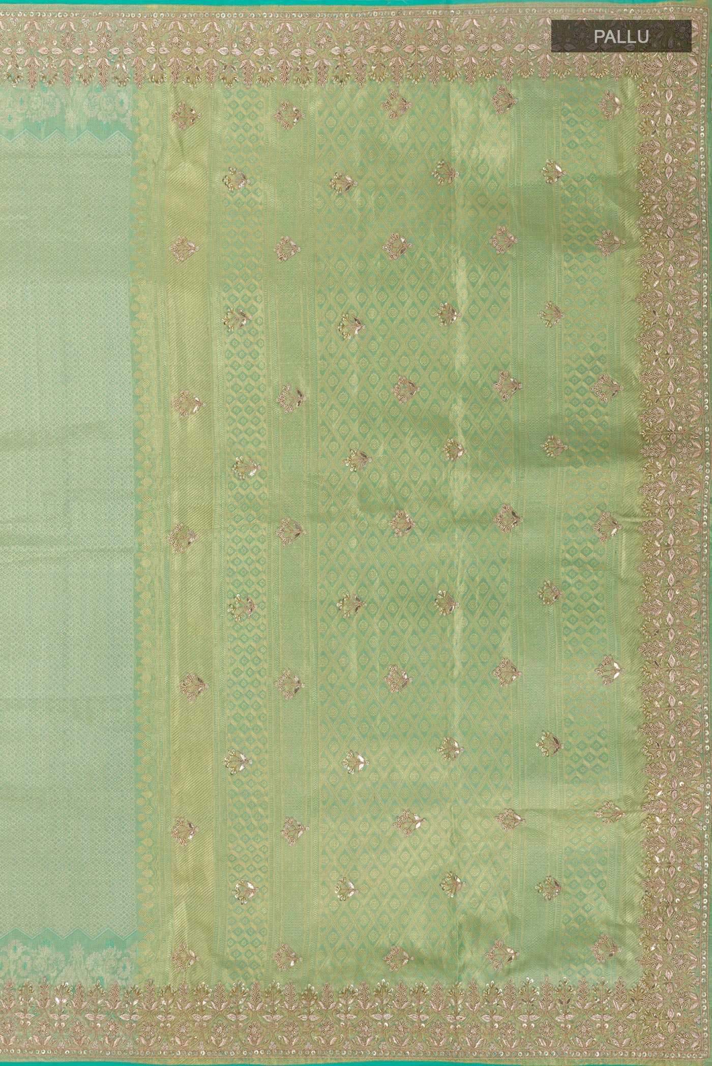 Close up image of the pallu of Sea Green Kanjivaram Tissue Silk Saree with Zari Butta on the body and Embroidery Border. 