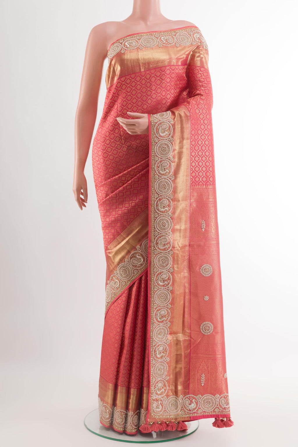 Red Kanjivaram Tissue Silk Saree with Zari Brocade on the body and Embroidery Border.  displayed on a mannequin