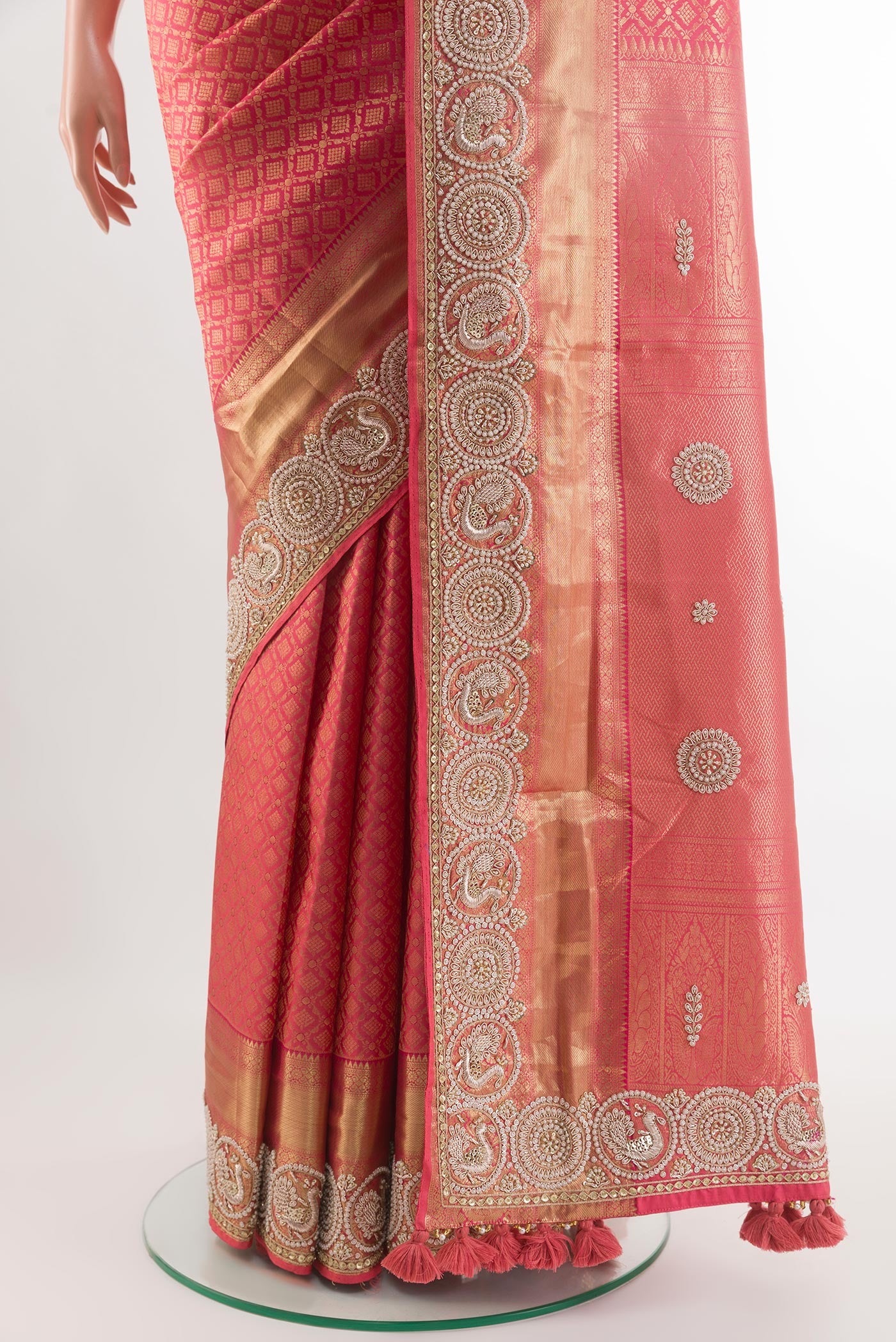 Pleats and pallu of Red Kanjivaram Tissue Silk Saree with Zari Brocade on the body and Embroidery Border. 