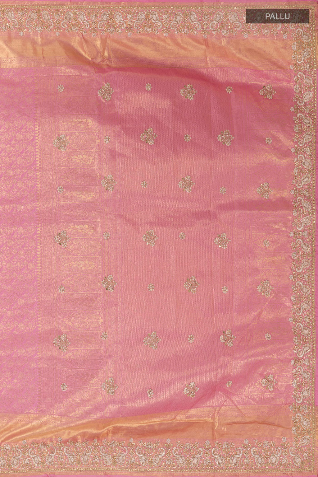 Close up image of the pallu of Pink Kanjivaram Tissue Silk Saree with Zari Butta on the body and Embroidery Border. 