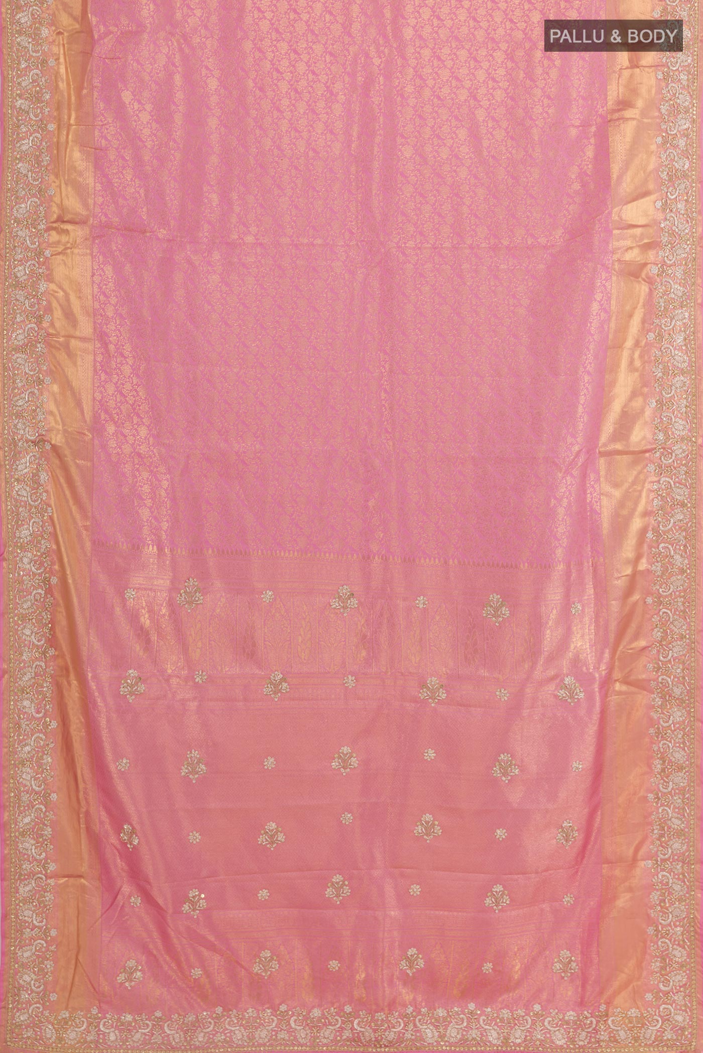 Flat view of Pink Kanjivaram Tissue Silk Saree with Zari Butta on the body and Embroidery Border. 