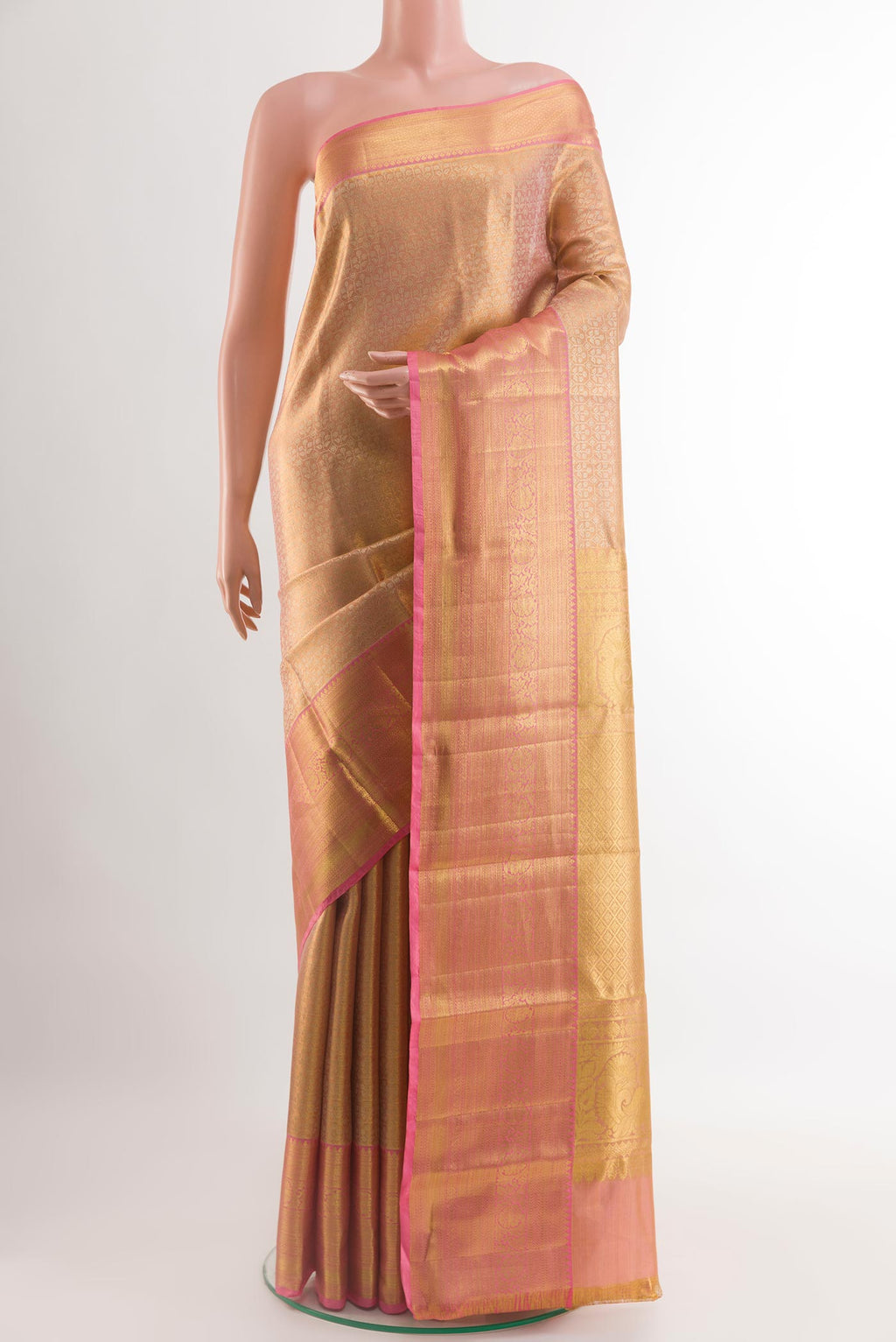 Rose Gold Kanchipuram Silk Saree with Zari Brocade on the body and Zari Border.  displayed on a mannequin