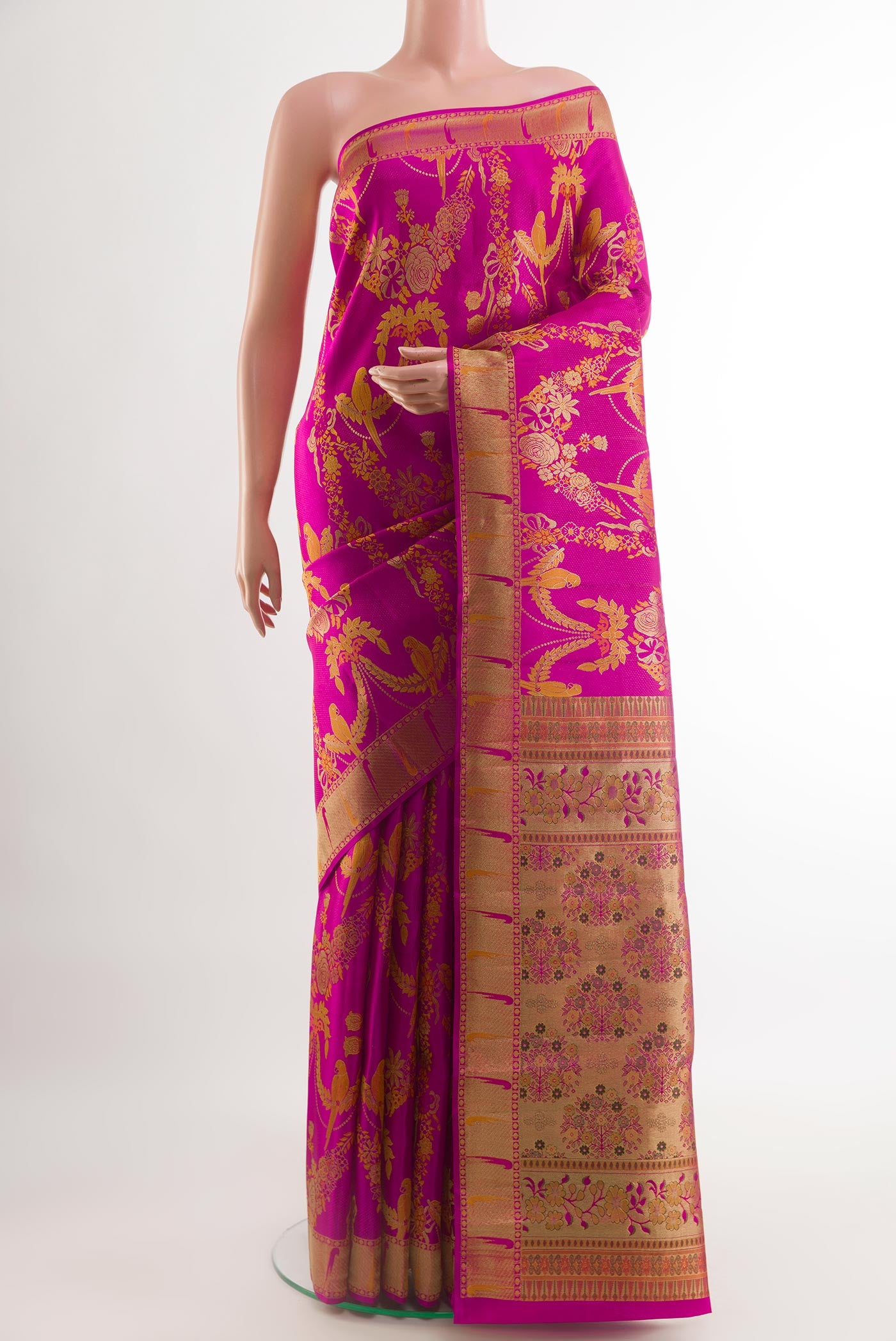 Pink Kanjivaram Silk Saree with Zari Brocade on the body and Zari Border.  displayed on a mannequin