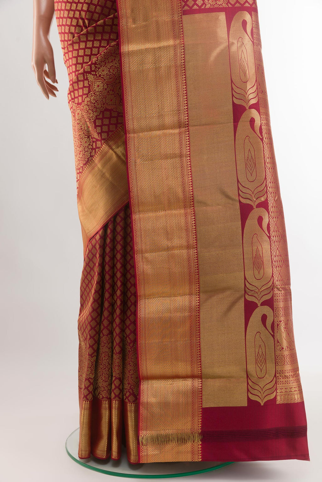 Pleats and pallu of Maroon Kanjivaram Silk Saree with Zari Brocade on the body and Zari Border. 