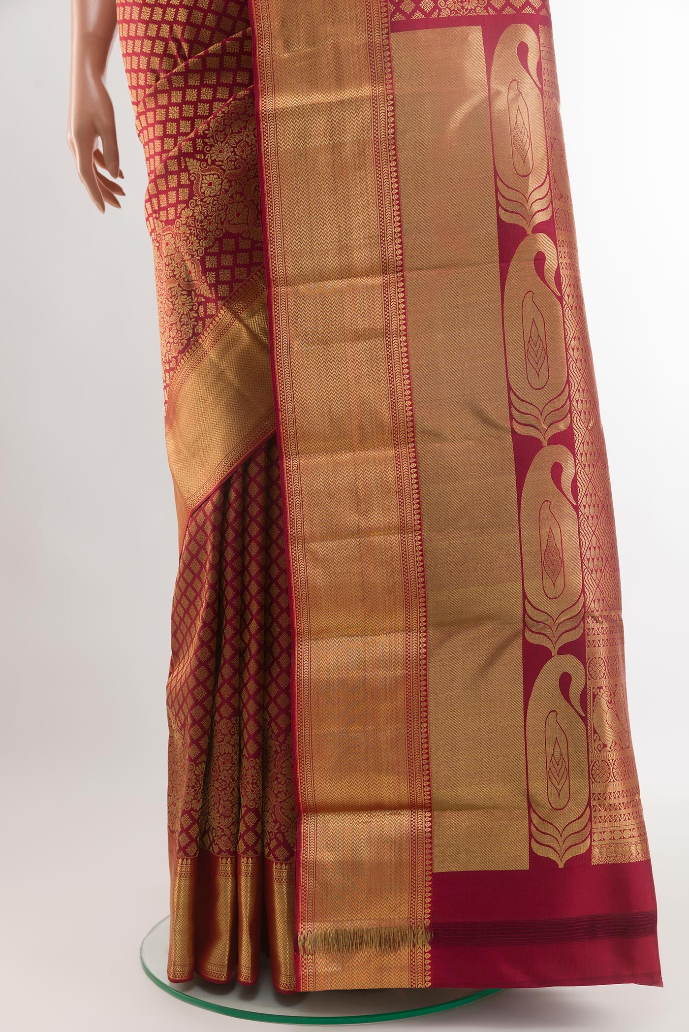 Pleats and pallu of Maroon Kanjivaram Silk Saree with Zari Brocade on the body and Zari Border. 