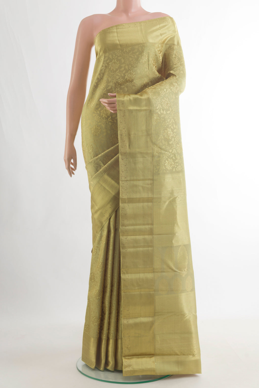 Pure Silk Green Kanjivaram Saree with Zari Brocade on the body and Zari Border.  displayed on a mannequin