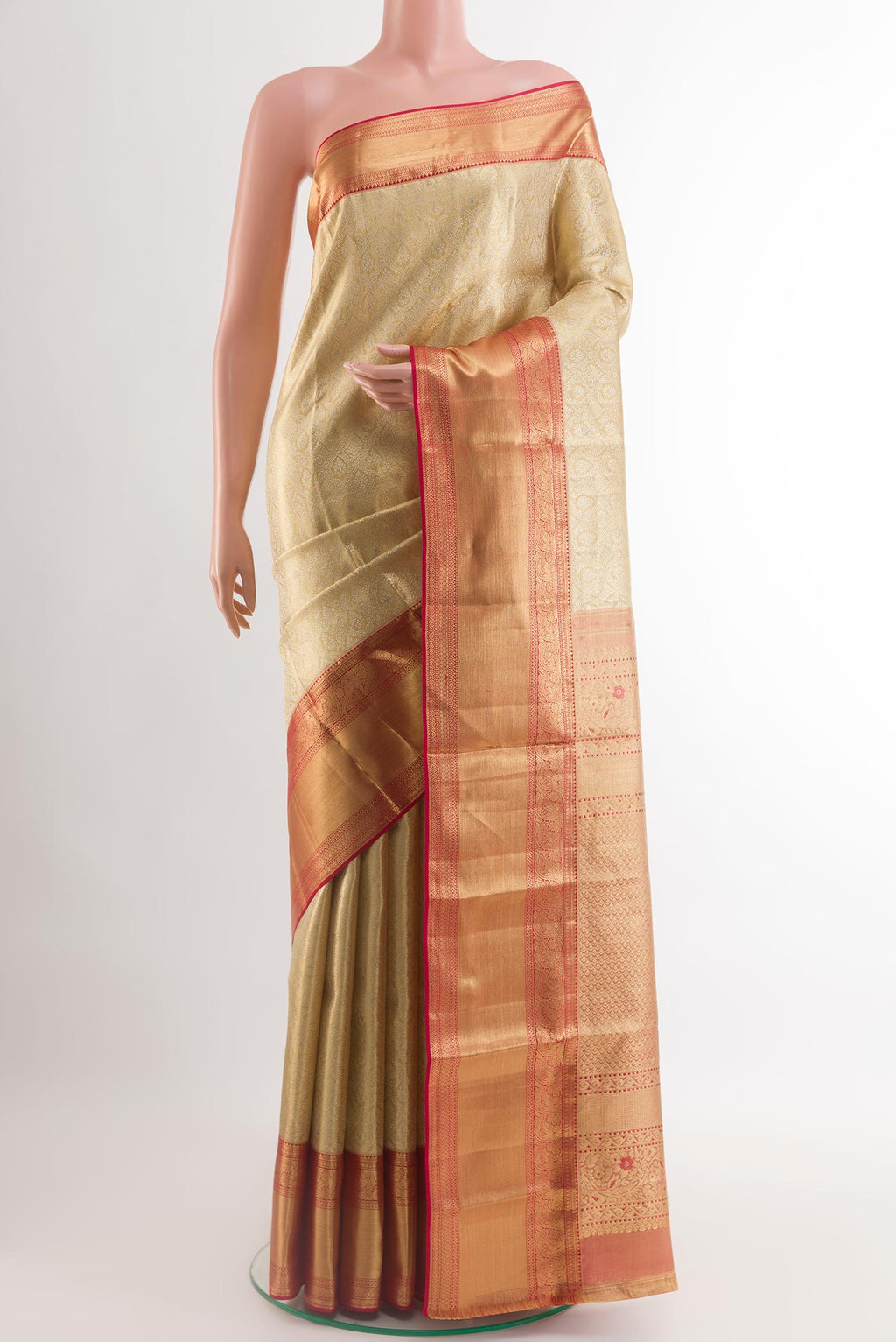 Golden Kanjivaram Silk Saree with Zari Brocade on the body and Zari Border.  displayed on a mannequin