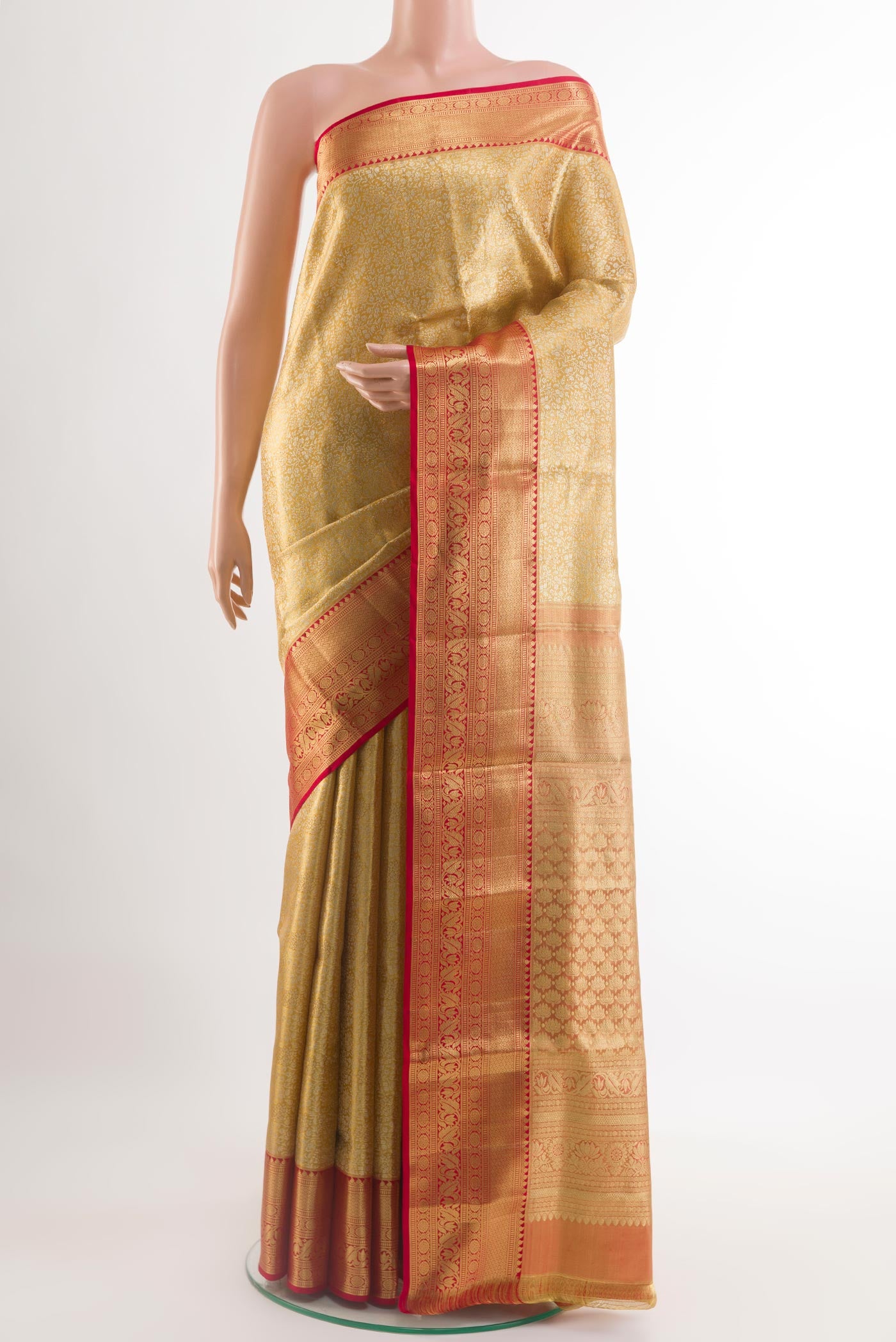 Golden Kanjivaram Silk Saree with Zari Brocade on the body and Zari Border.  displayed on a mannequin