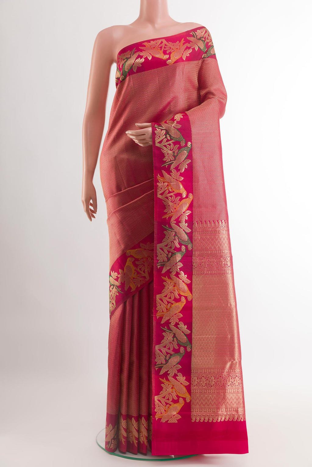 Pink Kanjivaram Silk Saree with Zari Brocade on the body and Zari Border.  displayed on a mannequin