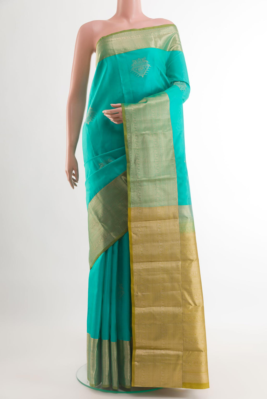 Blue Kanchipuram Silk Saree with Zari Butta on the body and Zari Border.  displayed on a mannequin