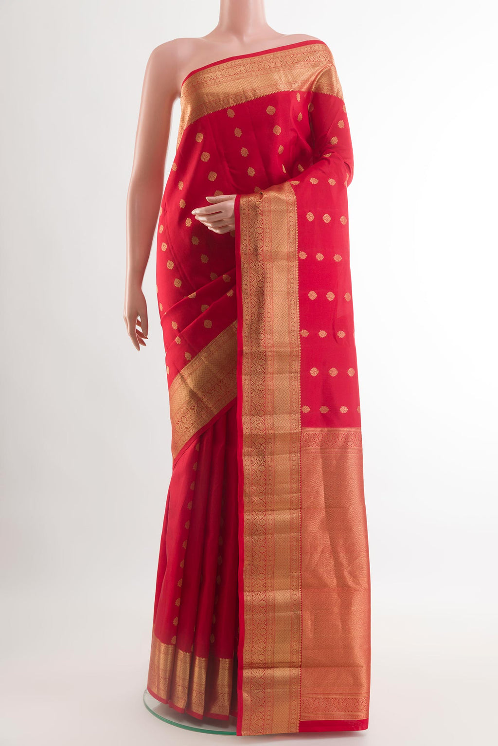 Red Kanchipuram Silk Saree with Zari Butta on the body and Zari Border.  displayed on a mannequin