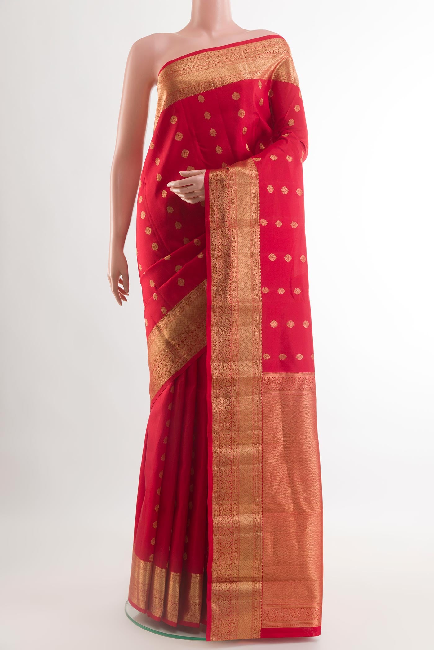 Red Kanchipuram Silk Saree with Zari Butta on the body and Zari Border.  displayed on a mannequin