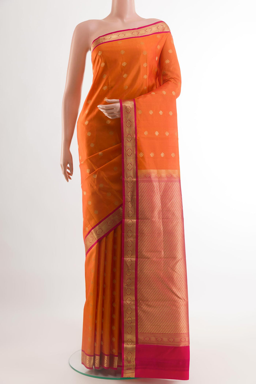 Orange Kanchipuram Silk Saree with Zari Butta on the body and Zari Border.  displayed on a mannequin