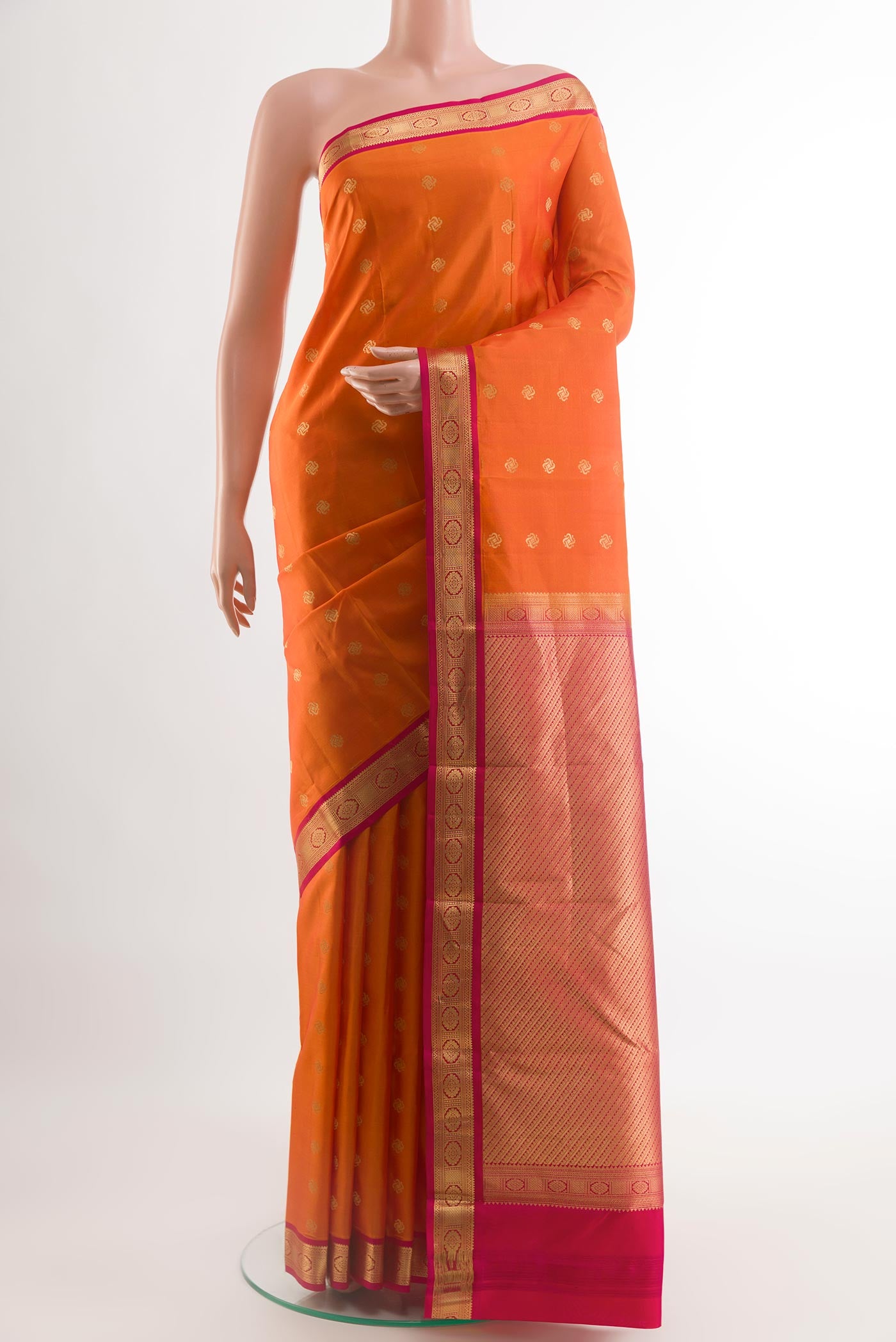 Orange Kanchipuram Silk Saree with Zari Butta on the body and Zari Border.  displayed on a mannequin