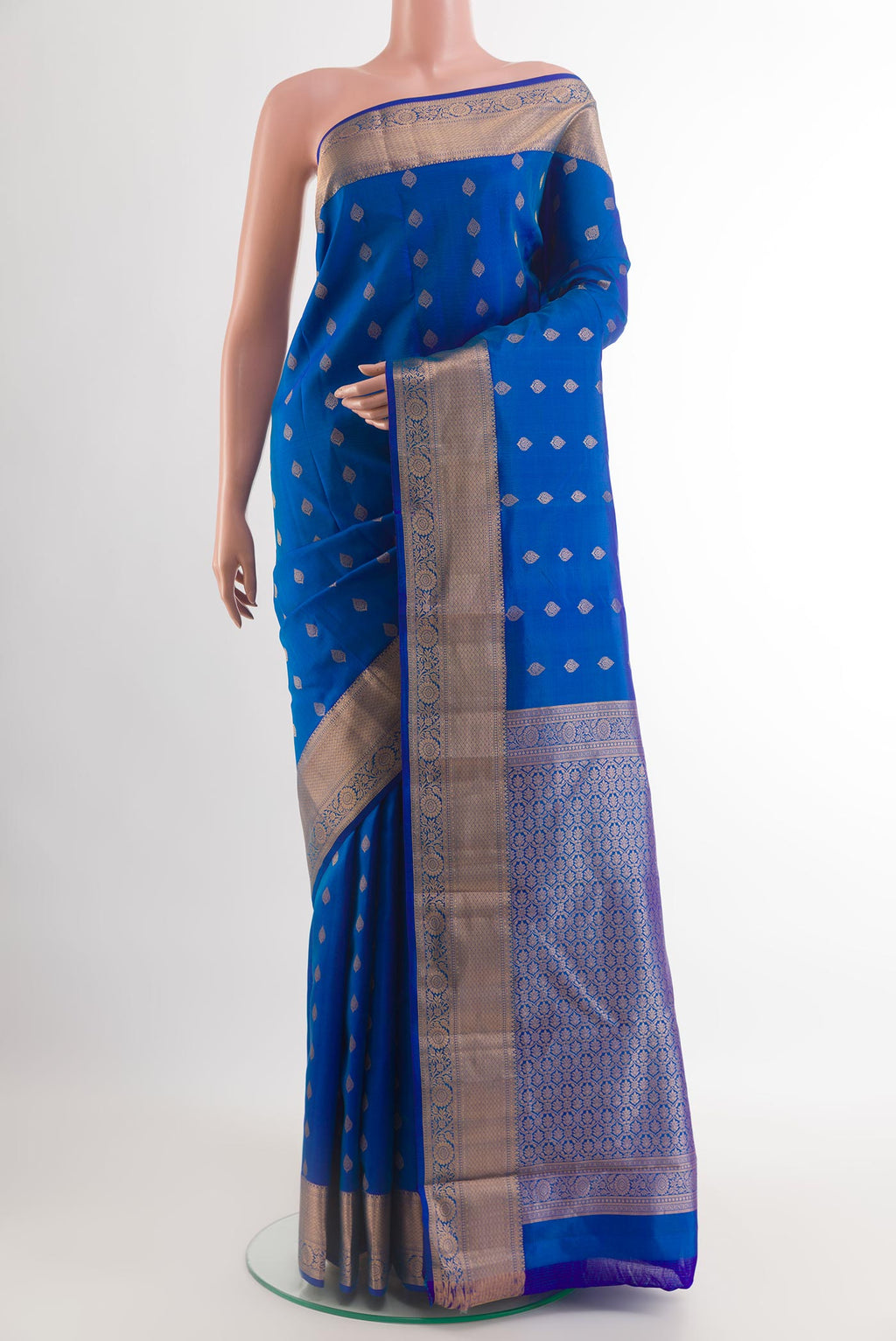 Blue Kanchipuram Silk Saree with Zari Butta on the body and Zari Border.  displayed on a mannequin