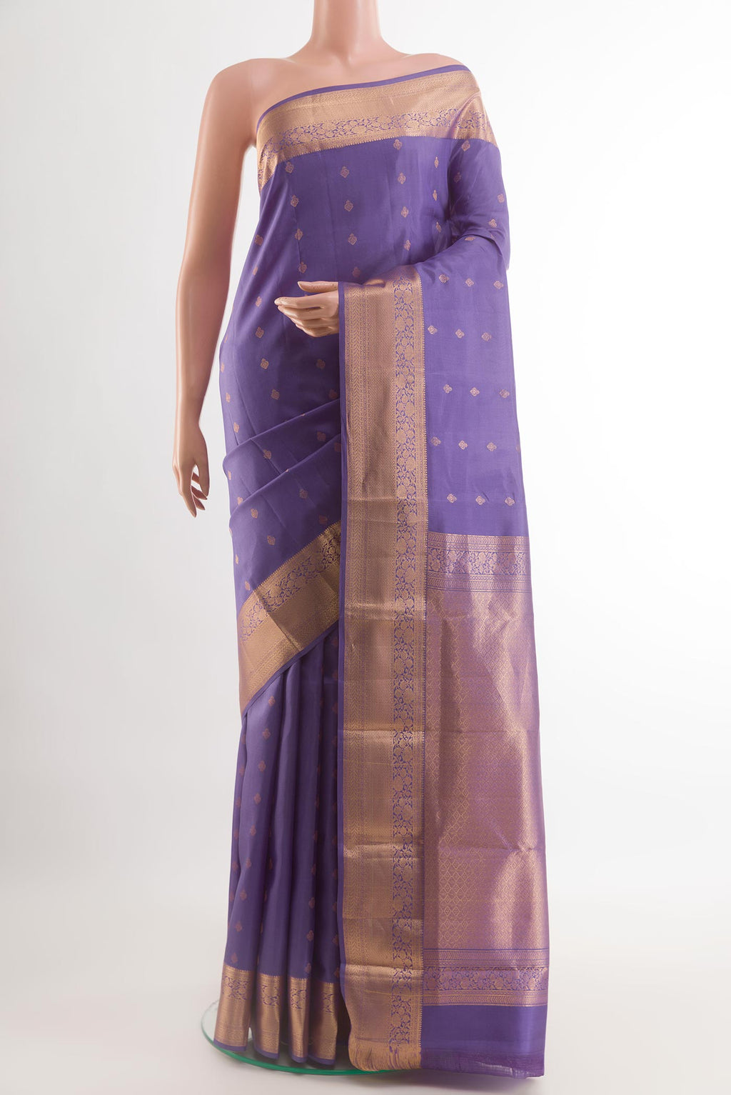 Purple Kanchipuram Silk Saree with Zari Butta on the body and Zari Border.  displayed on a mannequin