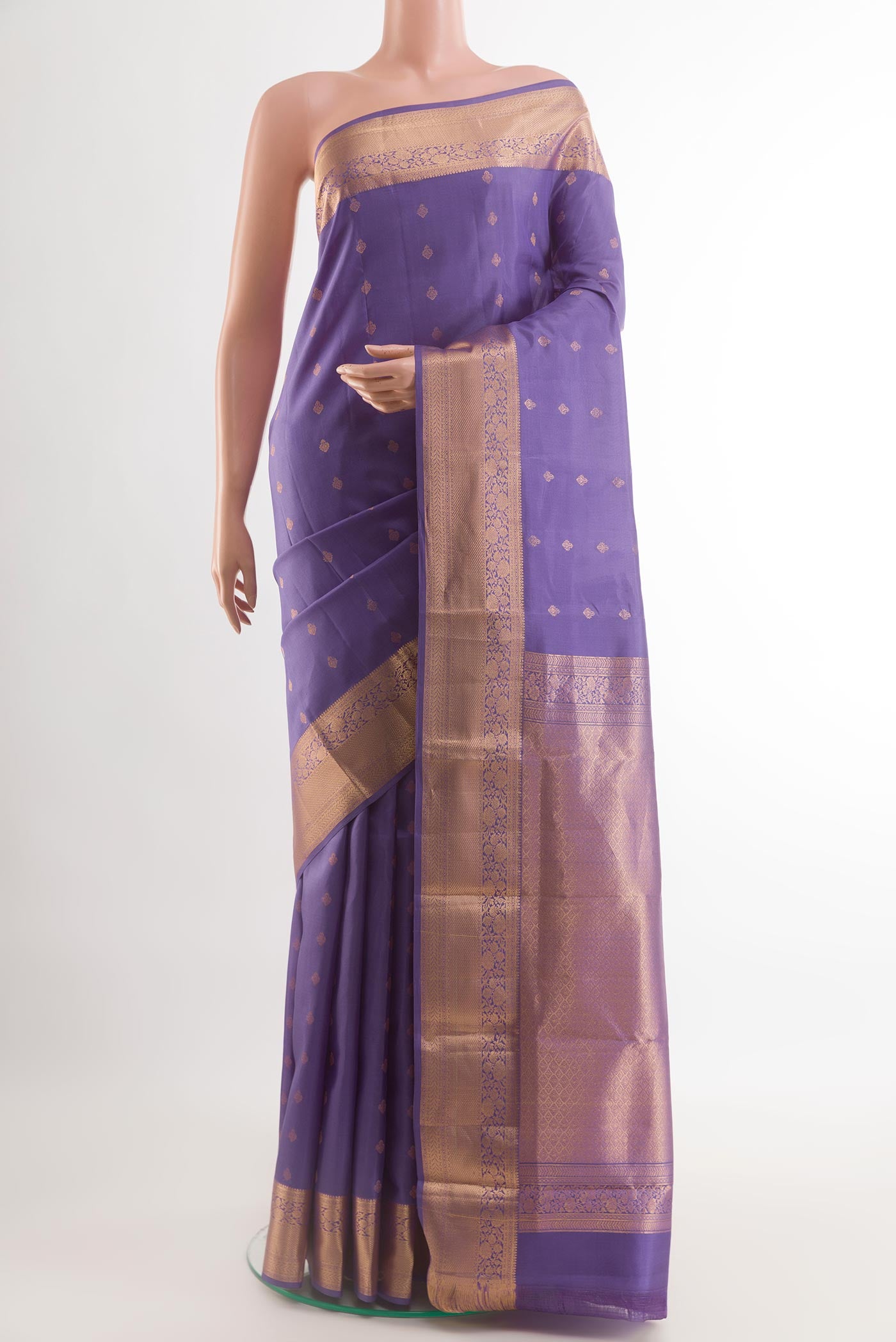 Purple Kanchipuram Silk Saree with Zari Butta on the body and Zari Border.  displayed on a mannequin