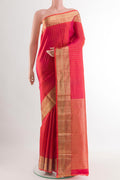 Pink Kanchipuram Silk Saree with Zari Butta on the body and Zari Border.  displayed on a mannequin