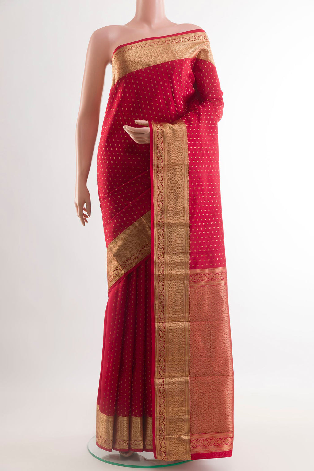 Red Kanchipuram Silk Saree with Zari Butta on the body and Zari Border.  displayed on a mannequin