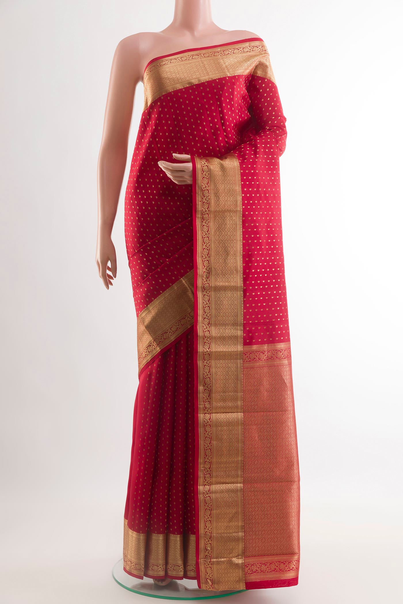 Red Kanchipuram Silk Saree with Zari Butta on the body and Zari Border.  displayed on a mannequin
