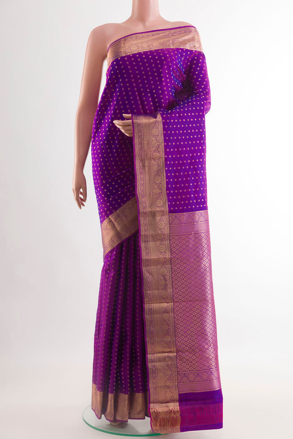 Purple Kanchipuram Silk Saree with Zari Butta on the body and Zari Border.  displayed on a mannequin