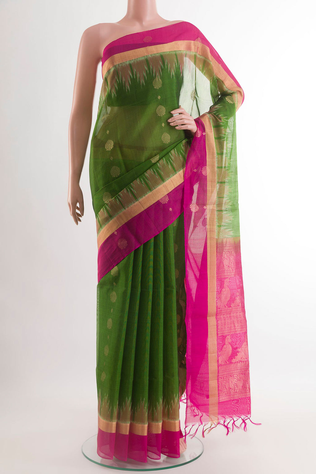 Green Blended Kora Cotton Saree with Zari Butta on the body and Zari Border.  displayed on a mannequin